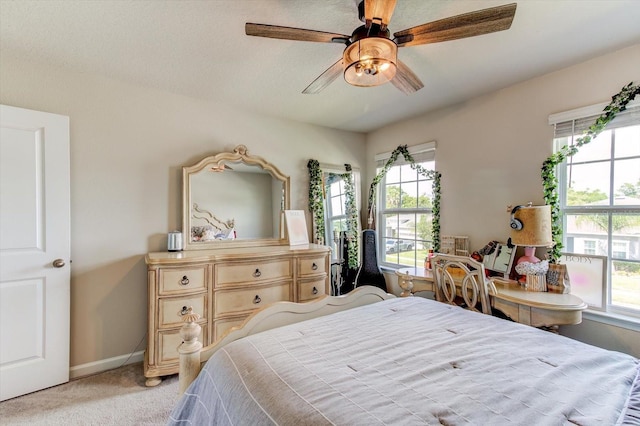 2149 Tudor Rose Dr, Sanford, FL 32773 - bedroom featuring light carpet, multiple windows, and a ceiling fan