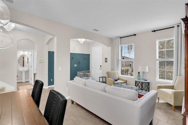3472 Gretchen Dr, Ocoee, FL 34761 - living area featuring arched walkways and light tile patterned floors