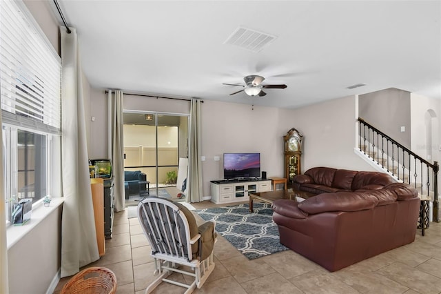 3472 Gretchen Dr, Ocoee, FL 34761 - living area with a ceiling fan, stairs, and light tile patterned floors