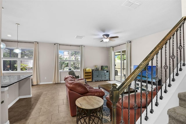 3472 Gretchen Dr, Ocoee, FL 34761 - living room with healthy amount of natural light, stairs, ceiling fan, and tile patterned floors
