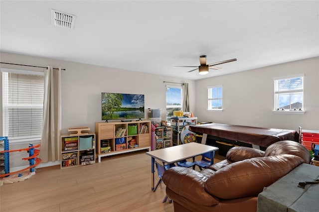 3472 Gretchen Dr, Ocoee, FL 34761 - living area with light wood-style flooring and a ceiling fan