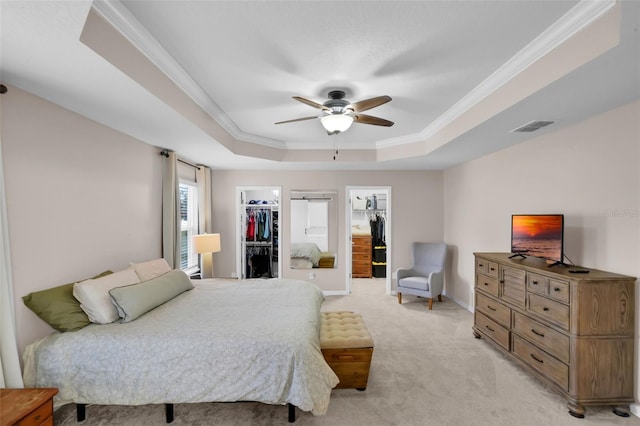 3472 Gretchen Dr, Ocoee, FL 34761 - bedroom with a raised ceiling, light carpet, ornamental molding, a spacious closet, and ceiling fan