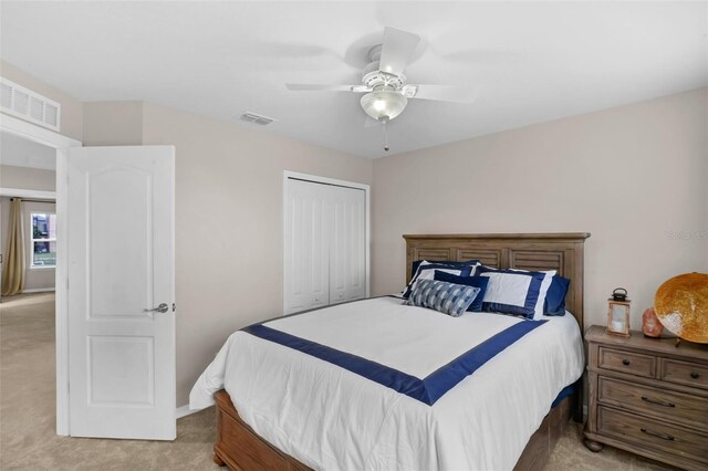 3472 Gretchen Dr, Ocoee, FL 34761 - bedroom featuring light carpet, a closet, and ceiling fan