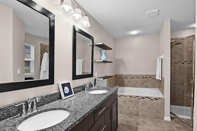 3472 Gretchen Dr, Ocoee, FL 34761 - bathroom with a shower stall, a garden tub, double vanity, and tile patterned floors