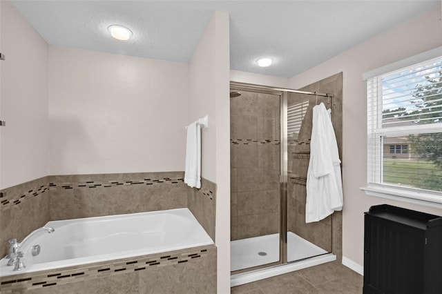 3472 Gretchen Dr, Ocoee, FL 34761 - full bath featuring a garden tub, a shower stall, and tile patterned flooring