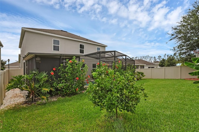 3472 Gretchen Dr, Ocoee, FL 34761 - back of property with stucco siding and a sunroom