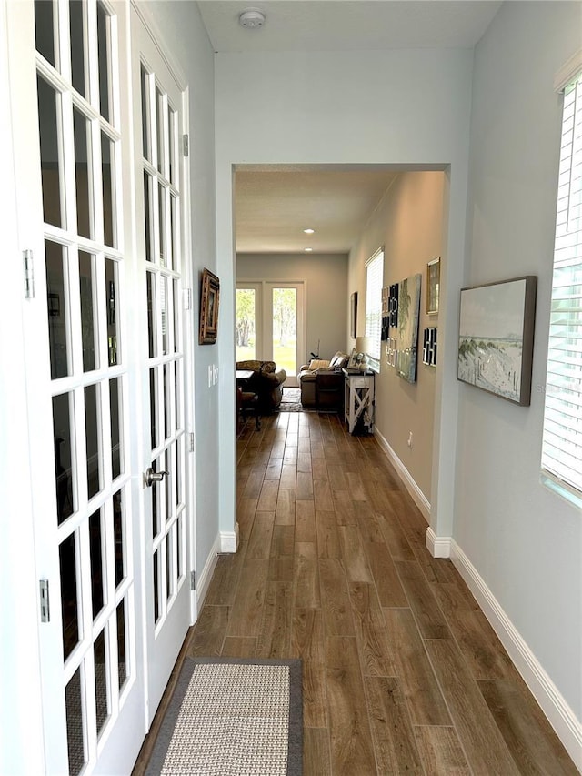 2042 Key Bay Trl, Kissimmee, FL 34747 - hallway with french doors and dark wood-type flooring