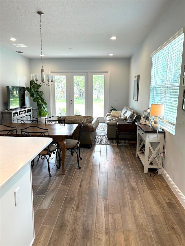 2042 Key Bay Trl, Kissimmee, FL 34747 - living area featuring wood finished floors, a chandelier, and recessed lighting