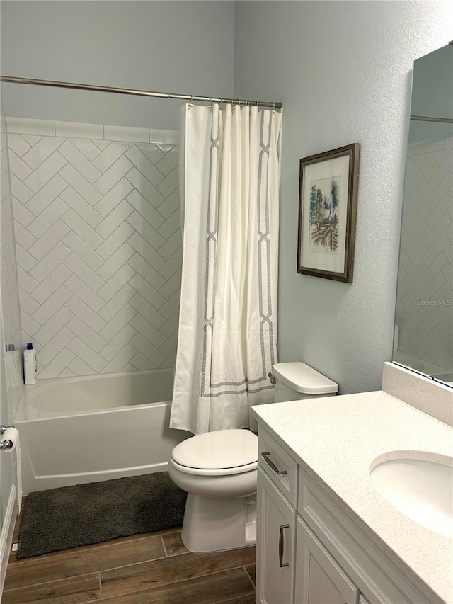 2042 Key Bay Trl, Kissimmee, FL 34747 - bathroom featuring wood finish floors, vanity, and shower / bath combo with shower curtain