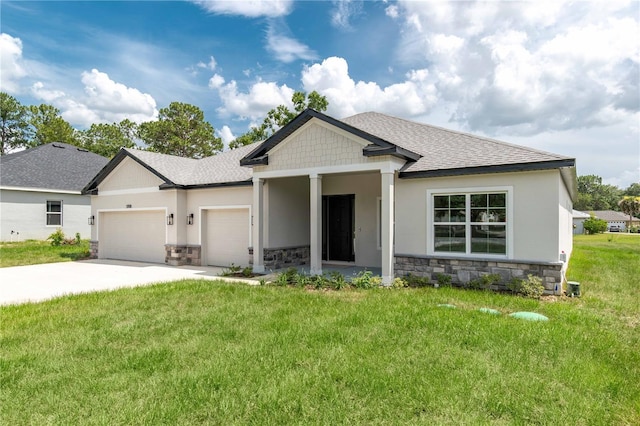 5908 SW 115 Street Rd, Ocala, FL 34476 - view of front of property with stone siding, a garage, a shingled roof, concrete driveway, and a front lawn