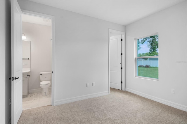5908 SW 115 Street Rd, Ocala, FL 34476 - unfurnished bedroom featuring light carpet and ensuite bathroom