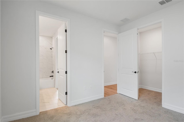 5908 SW 115 Street Rd, Ocala, FL 34476 - unfurnished bedroom with carpet floors, a walk in closet, and a closet