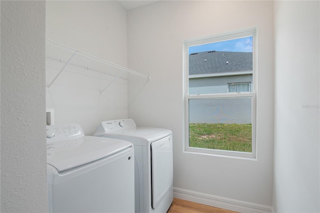 5908 SW 115 Street Rd, Ocala, FL 34476 - laundry room with independent washer and dryer and light wood finished floors