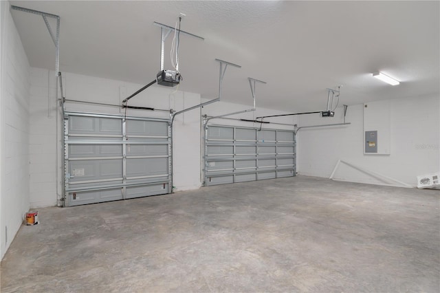 5908 SW 115 Street Rd, Ocala, FL 34476 - garage with a garage door opener, electric panel, and concrete block wall