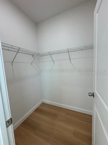 2664 SW De Groodt Rd, Palm Bay, FL 32908 - spacious closet with wood finished floors