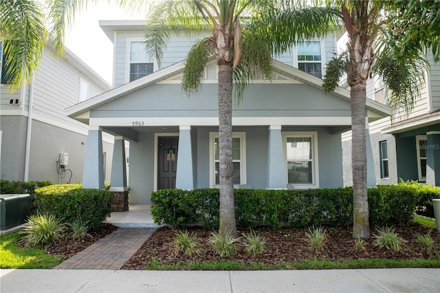 5963 Glory Bower Dr, Winter Garden, FL 34787 - view of front facade with a porch and stucco siding