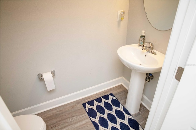 5963 Glory Bower Dr, Winter Garden, FL 34787 - bathroom featuring wood finished floors and toilet