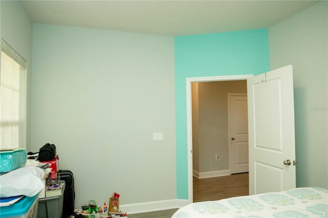 5963 Glory Bower Dr, Winter Garden, FL 34787 - bedroom featuring wood finished floors and baseboards