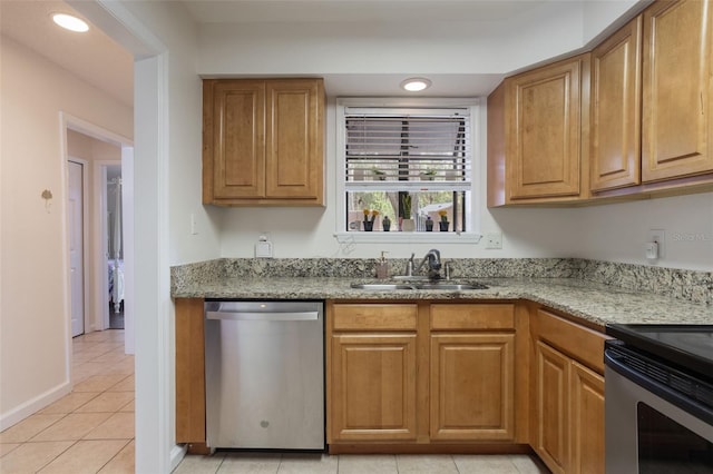 940 Douglas Ave Unit 159, Altamonte Springs, FL 32714 - kitchen with appliances with stainless steel finishes, light stone countertops, light tile patterned flooring, brown cabinetry, and recessed lighting
