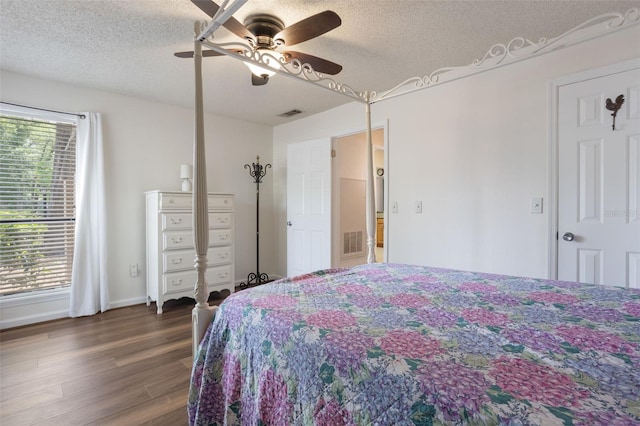 940 Douglas Ave Unit 159, Altamonte Springs, FL 32714 - bedroom with a textured ceiling, wood finished floors, and a ceiling fan