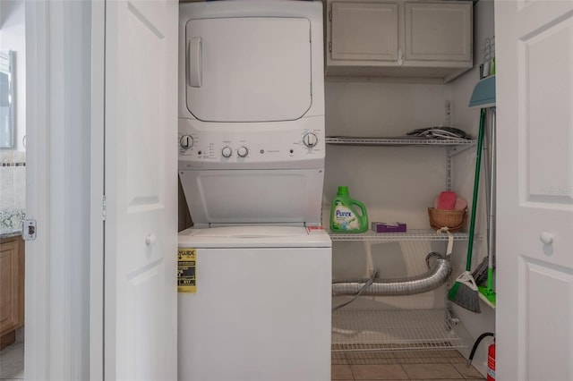 940 Douglas Ave Unit 159, Altamonte Springs, FL 32714 - laundry room with stacked washer and clothes dryer and tile patterned floors