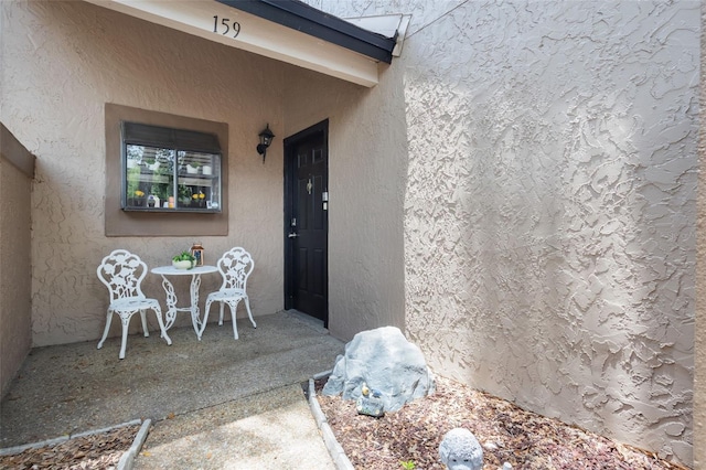 940 Douglas Ave Unit 159, Altamonte Springs, FL 32714 - doorway to property featuring stucco siding