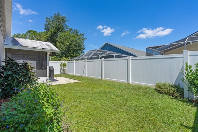144 Bridgeton St, Davenport, FL 33896 - fenced backyard with a patio area
