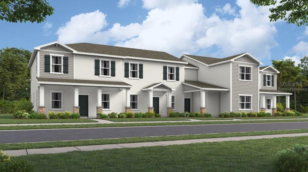 2840 Haze Rd, Clermont, FL 34714 - multi unit property featuring stucco siding and a front yard