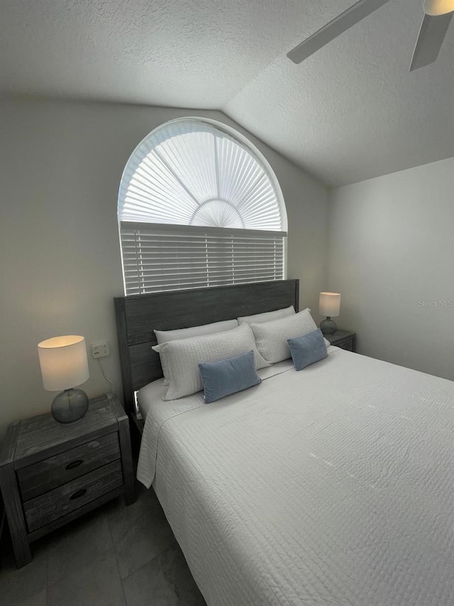 2505 Osprey Creek Ct, Kissimmee, FL 34747 - tiled bedroom featuring vaulted ceiling and a ceiling fan
