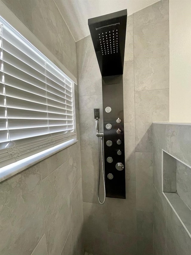 2505 Osprey Creek Ct, Kissimmee, FL 34747 - bathroom view of a tile shower and tile walls
