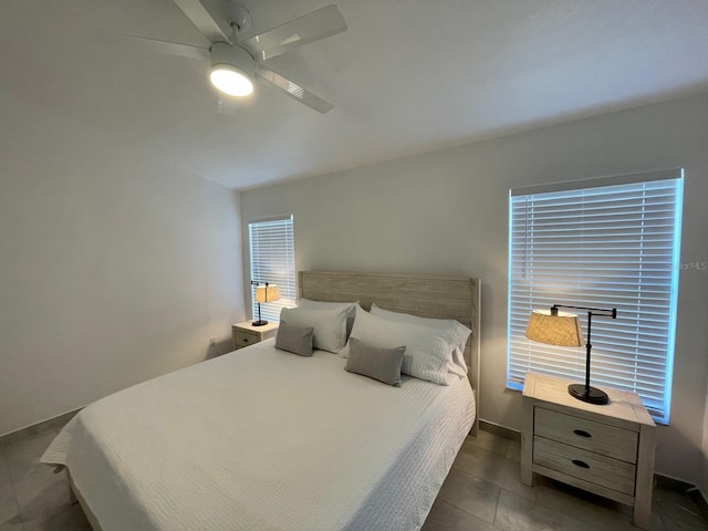 2505 Osprey Creek Ct, Kissimmee, FL 34747 - bedroom with a ceiling fan and tile patterned floors