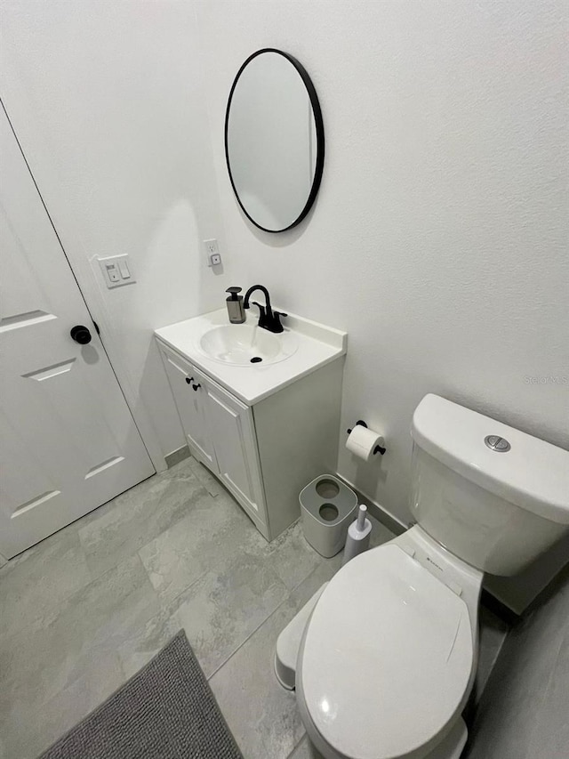 2505 Osprey Creek Ct, Kissimmee, FL 34747 - bathroom featuring vanity and marble finish floors