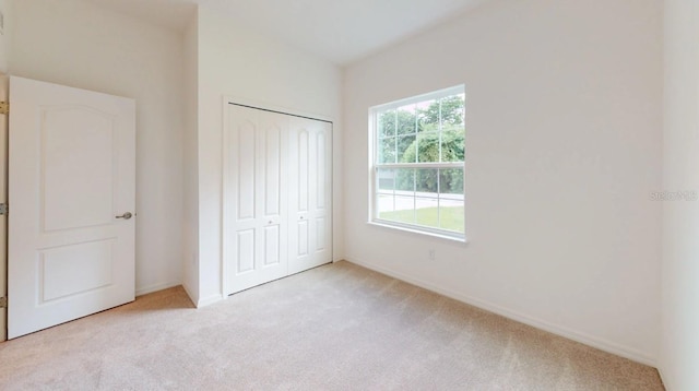 248 SW Cadence Gln, Lake City, FL 32024 - unfurnished bedroom featuring carpet flooring and a closet