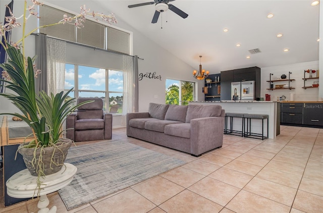 1315 Vista Del Lago Blvd, Dundee, FL 33838 - living area featuring a chandelier, light tile patterned flooring, high vaulted ceiling, ceiling fan, and recessed lighting