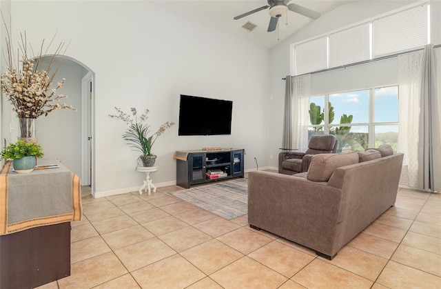 1315 Vista Del Lago Blvd, Dundee, FL 33838 - living area with light tile patterned flooring, ceiling fan, high vaulted ceiling, and arched walkways