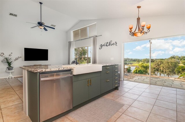 1315 Vista Del Lago Blvd, Dundee, FL 33838 - kitchen with dishwasher, light tile patterned floors, vaulted ceiling, a ceiling fan, and a chandelier
