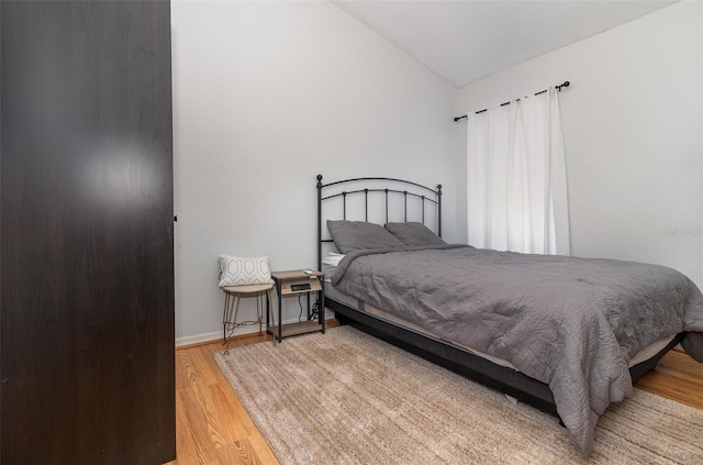 1315 Vista Del Lago Blvd, Dundee, FL 33838 - bedroom with wood finished floors and vaulted ceiling