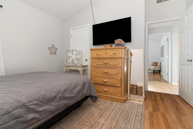1315 Vista Del Lago Blvd, Dundee, FL 33838 - bedroom featuring vaulted ceiling and light wood-style floors