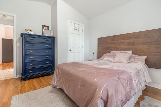 1315 Vista Del Lago Blvd, Dundee, FL 33838 - bedroom with lofted ceiling and light wood-type flooring