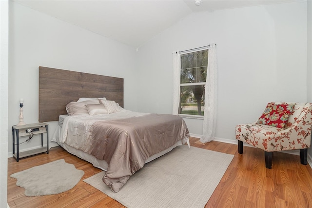 1315 Vista Del Lago Blvd, Dundee, FL 33838 - bedroom with lofted ceiling and wood finished floors