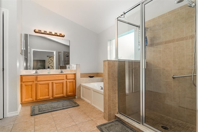 1315 Vista Del Lago Blvd, Dundee, FL 33838 - bathroom with vaulted ceiling, a stall shower, a bath, tile patterned floors, and double vanity