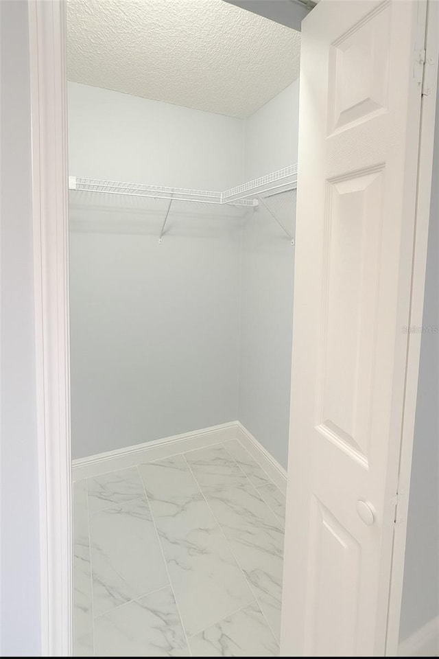 1784 Providence Blvd, Deltona, FL 32725 - walk in closet featuring marble look tiles