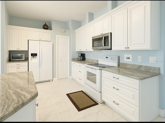 1784 Providence Blvd, Deltona, FL 32725 - kitchen with white appliances, white cabinetry, and light stone countertops
