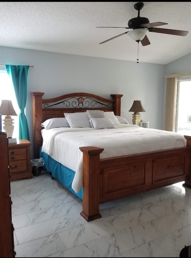 1784 Providence Blvd, Deltona, FL 32725 - bedroom featuring light marble finish floors, ceiling fan, and a textured ceiling