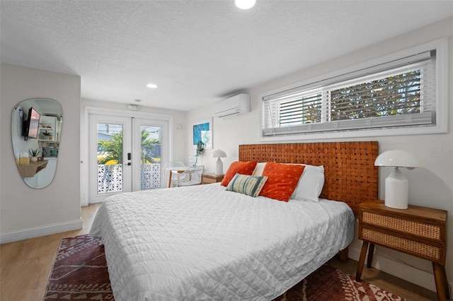 402 S Orlando Ave, Cocoa Beach, FL 32931 - bedroom featuring a wall unit AC, access to exterior, light wood finished floors, multiple windows, and recessed lighting