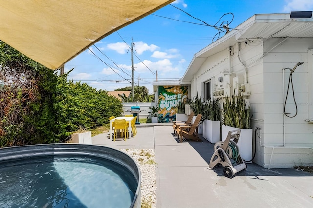 402 S Orlando Ave, Cocoa Beach, FL 32931 - view of swimming pool featuring a patio, grilling area, and outdoor dining area