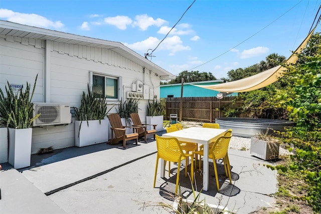 402 S Orlando Ave, Cocoa Beach, FL 32931 - view of patio featuring a hot tub and outdoor dining space