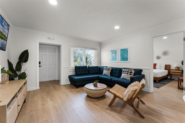 402 S Orlando Ave, Cocoa Beach, FL 32931 - living area with crown molding, light wood-style floors, and recessed lighting