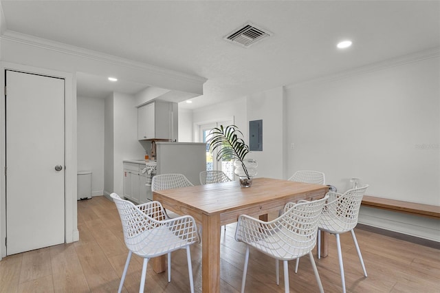 402 S Orlando Ave, Cocoa Beach, FL 32931 - dining area with electric panel, light wood-style floors, ornamental molding, and recessed lighting