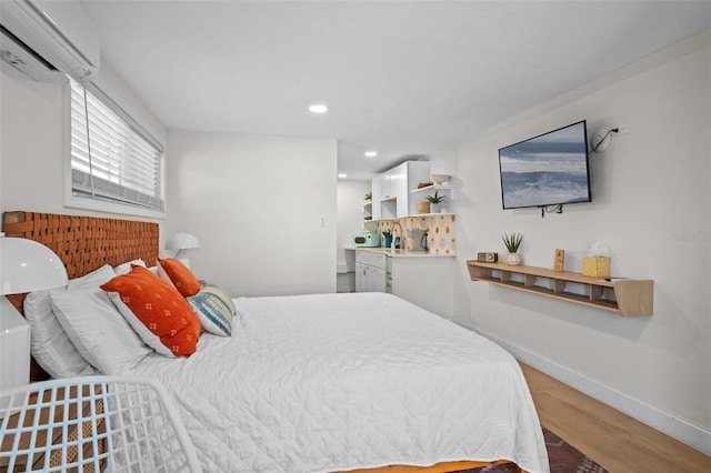402 S Orlando Ave, Cocoa Beach, FL 32931 - bedroom featuring a wall unit AC, wood finished floors, and recessed lighting